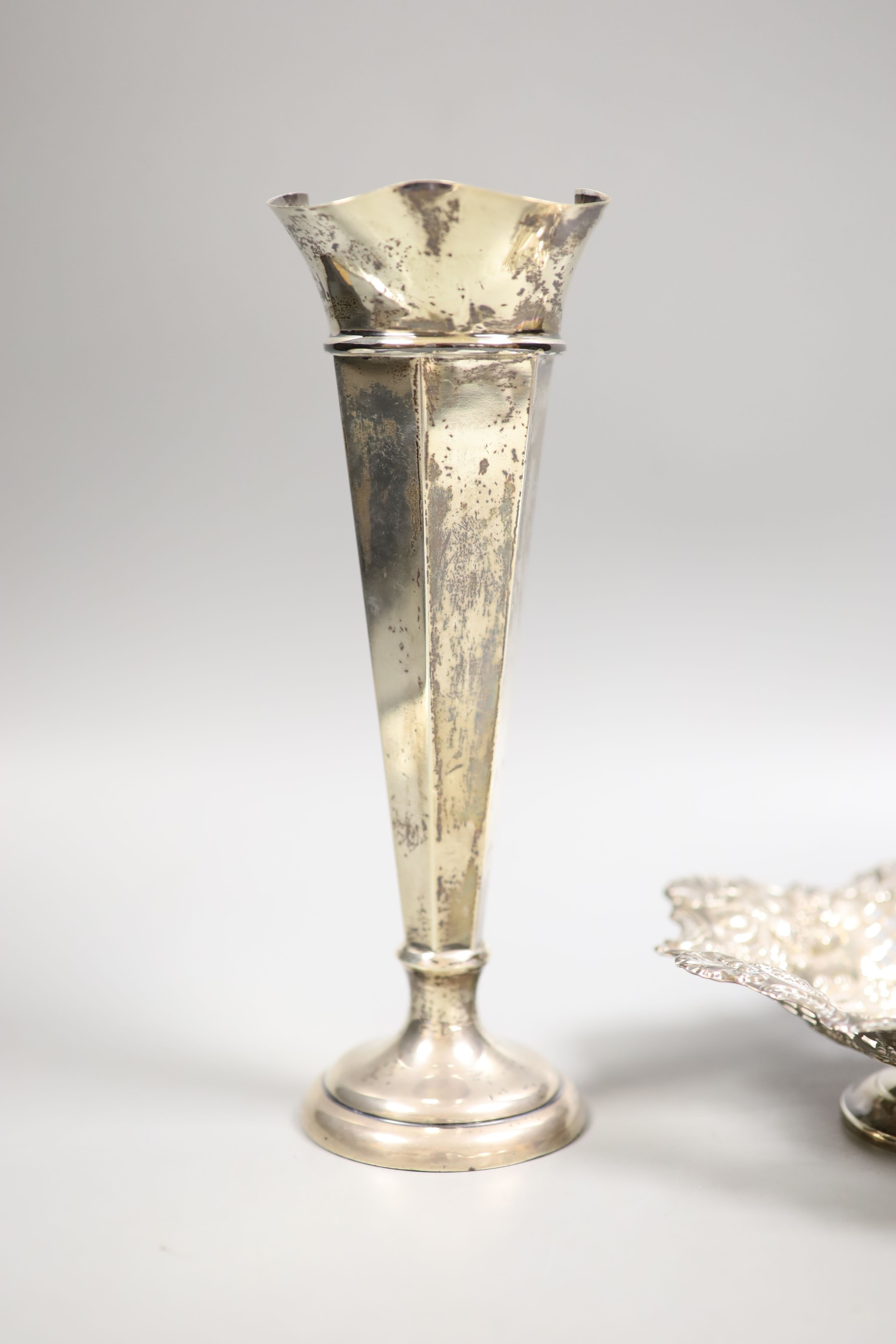 A late Victorian pierced silver pedestal bonbon dish, London, 1898, 16cm and a later silver mounted spill vase, 21.7cm, weighted.